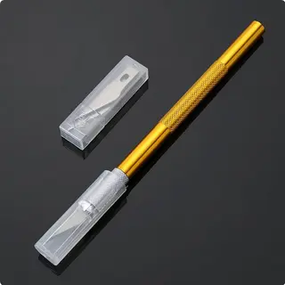 Nůž - skalpel modelářský s vyměnitelnýma planžetama - žlutý
